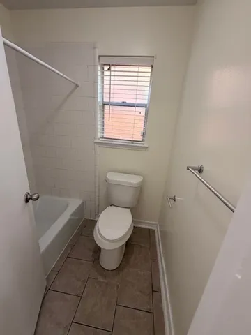 a spacious bathroom with a double vanity sink and mirror