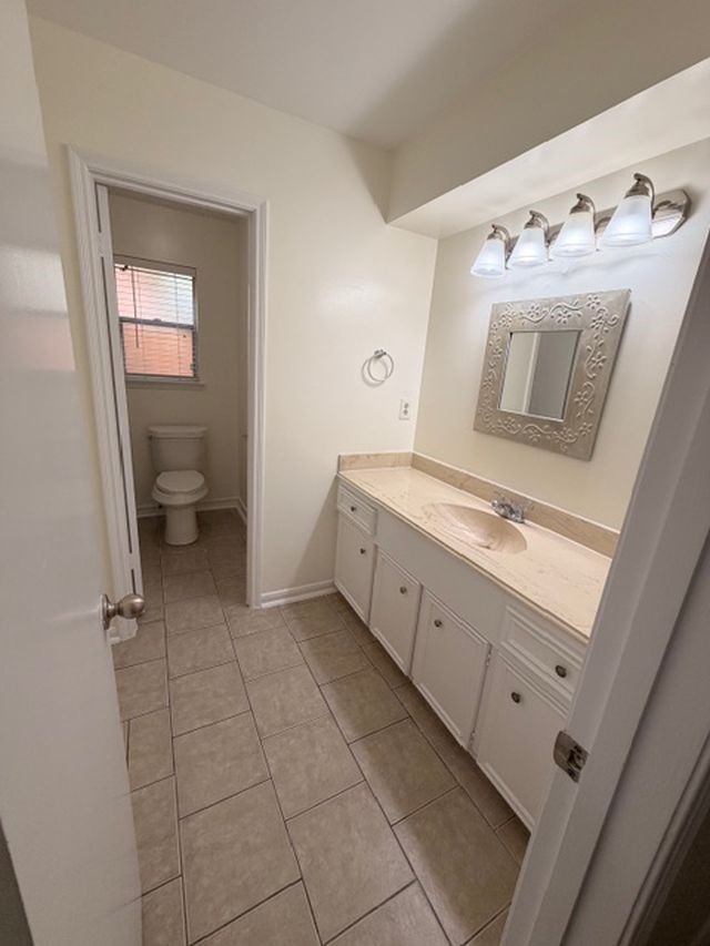 2807 Kenross Street Houston, TX 77043 - Photo 13 of 21 a spacious bathroom with a double vanity sink and mirror
