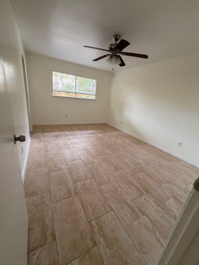 2807 Kenross Street Houston, TX 77043 - Photo 15 of 21 a view of an empty room with a window