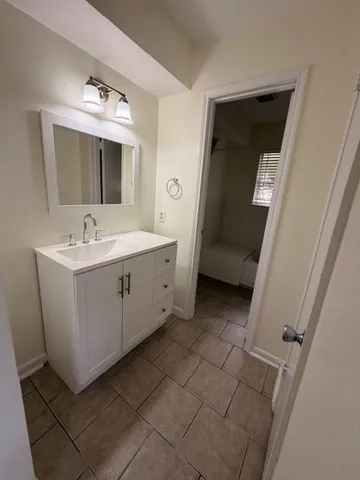a bathroom with a toilet and a bathtub