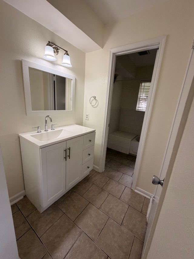 2807 Kenross Street Houston, TX 77043 - Photo 17 of 21 a bathroom with a sink and a mirror