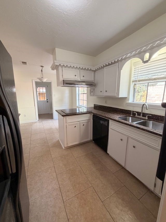 2807 Kenross Street Houston, TX 77043 - Photo 5 of 21 a large kitchen with a stove a sink dishwasher and a refrigerator