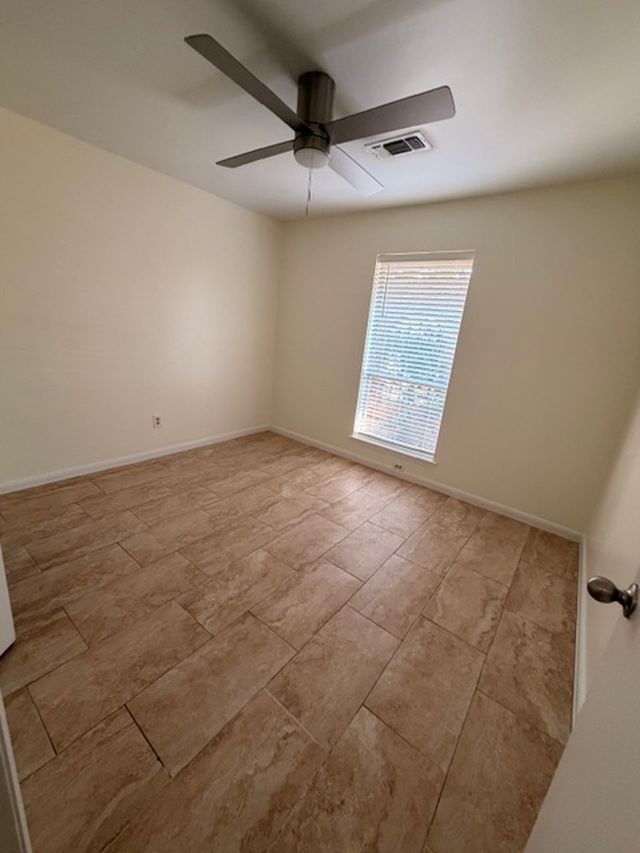 2807 Kenross Street Houston, TX 77043 - Photo 10 of 21 a view of an empty room and a window