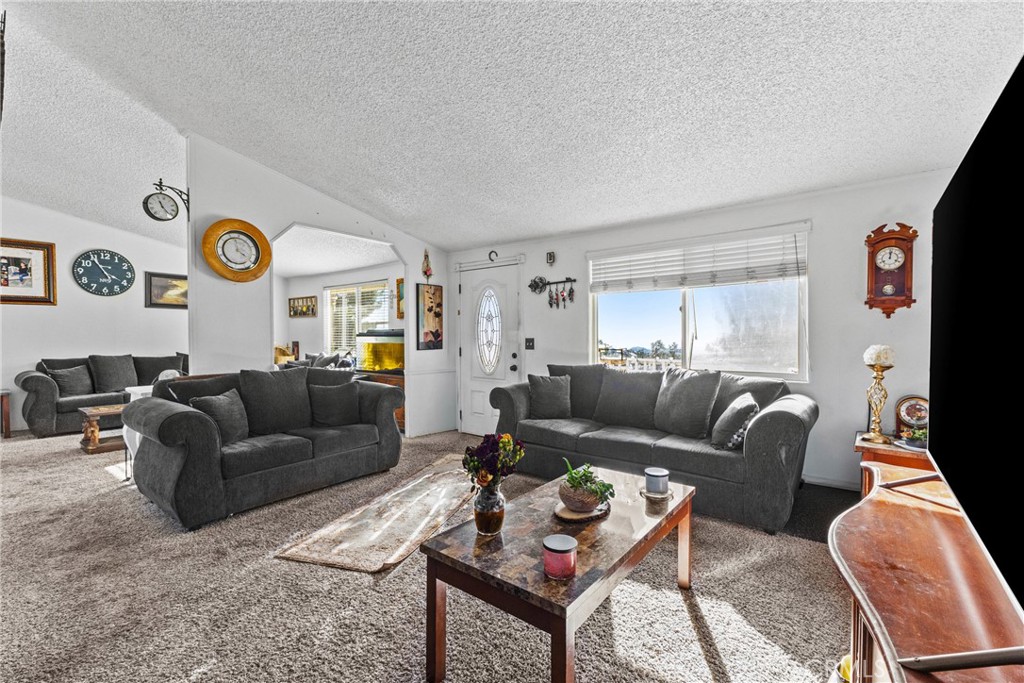 33945 Red Mountain Road Hemet, CA 92544 - Photo 12 of 30 a living room with furniture and a window