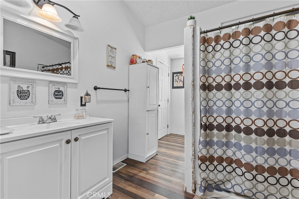 33945 Red Mountain Road Hemet, CA 92544 - Photo 16 of 30 a bathroom with a sink and a mirror