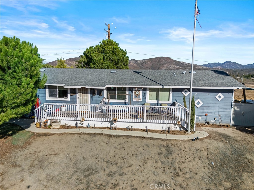 33945 Red Mountain Road Hemet, CA 92544 - Photo 5 of 30 a front view of a house with a porch