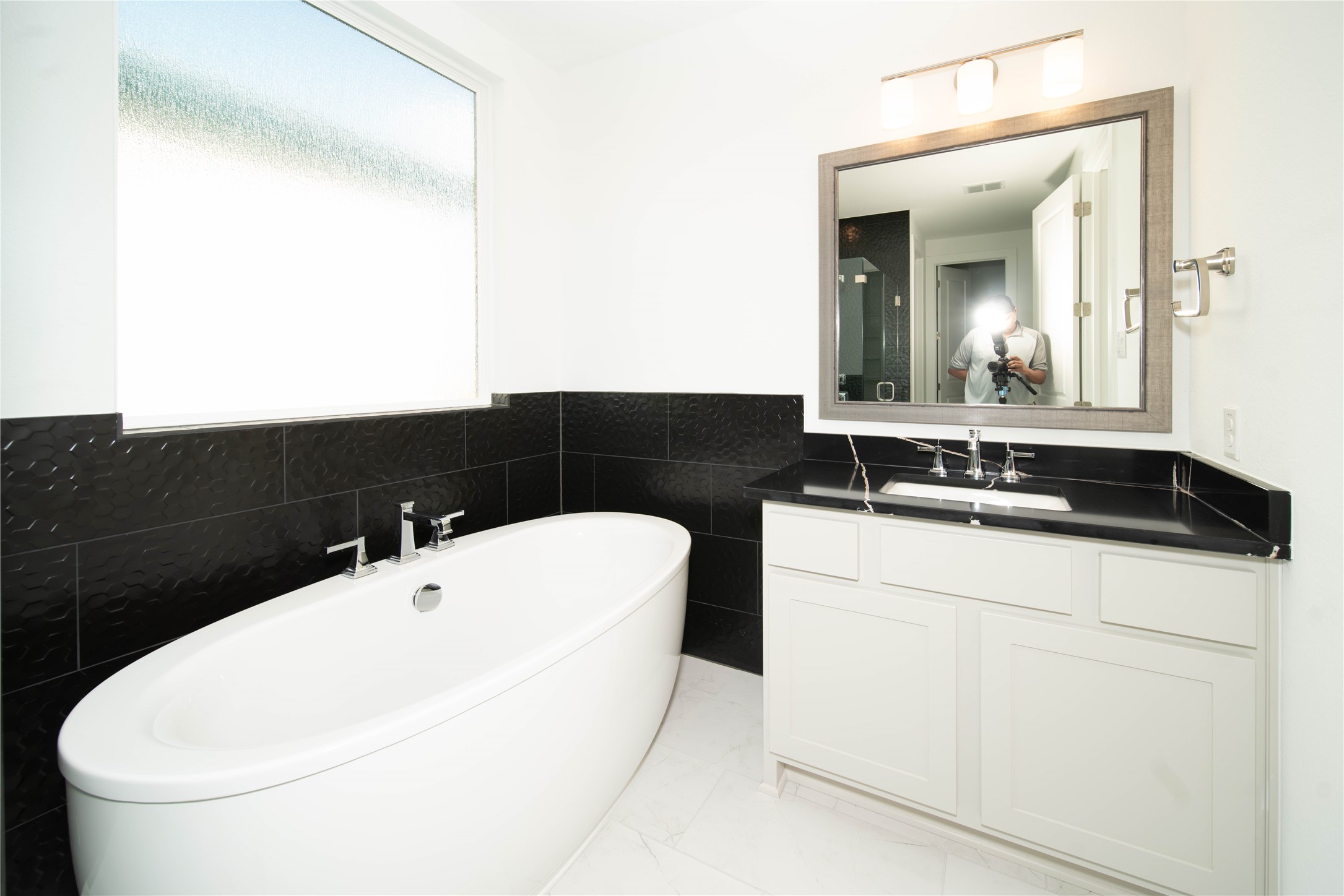 2029 Varese Path Leander, TX 78641 - Photo 12 of 32 a bathroom with a sink and a mirror