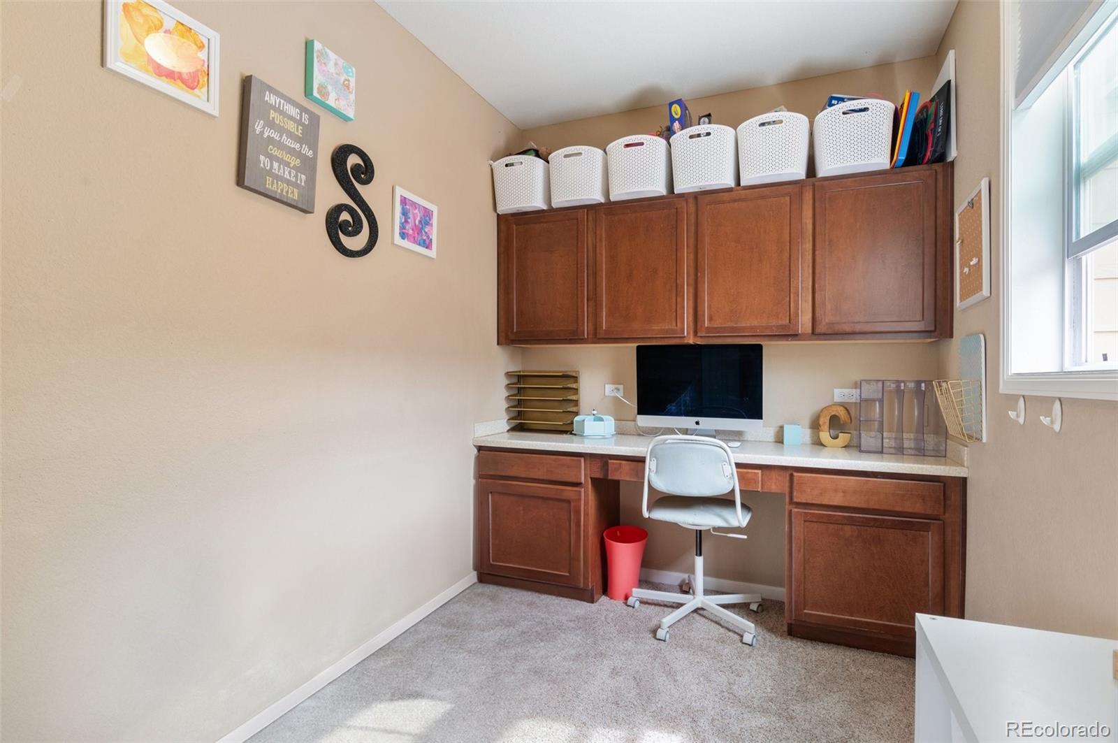 10995 Quintero Street Commerce City, CO 80022 - Photo 17 of 41 a room with cabinets and furniture
