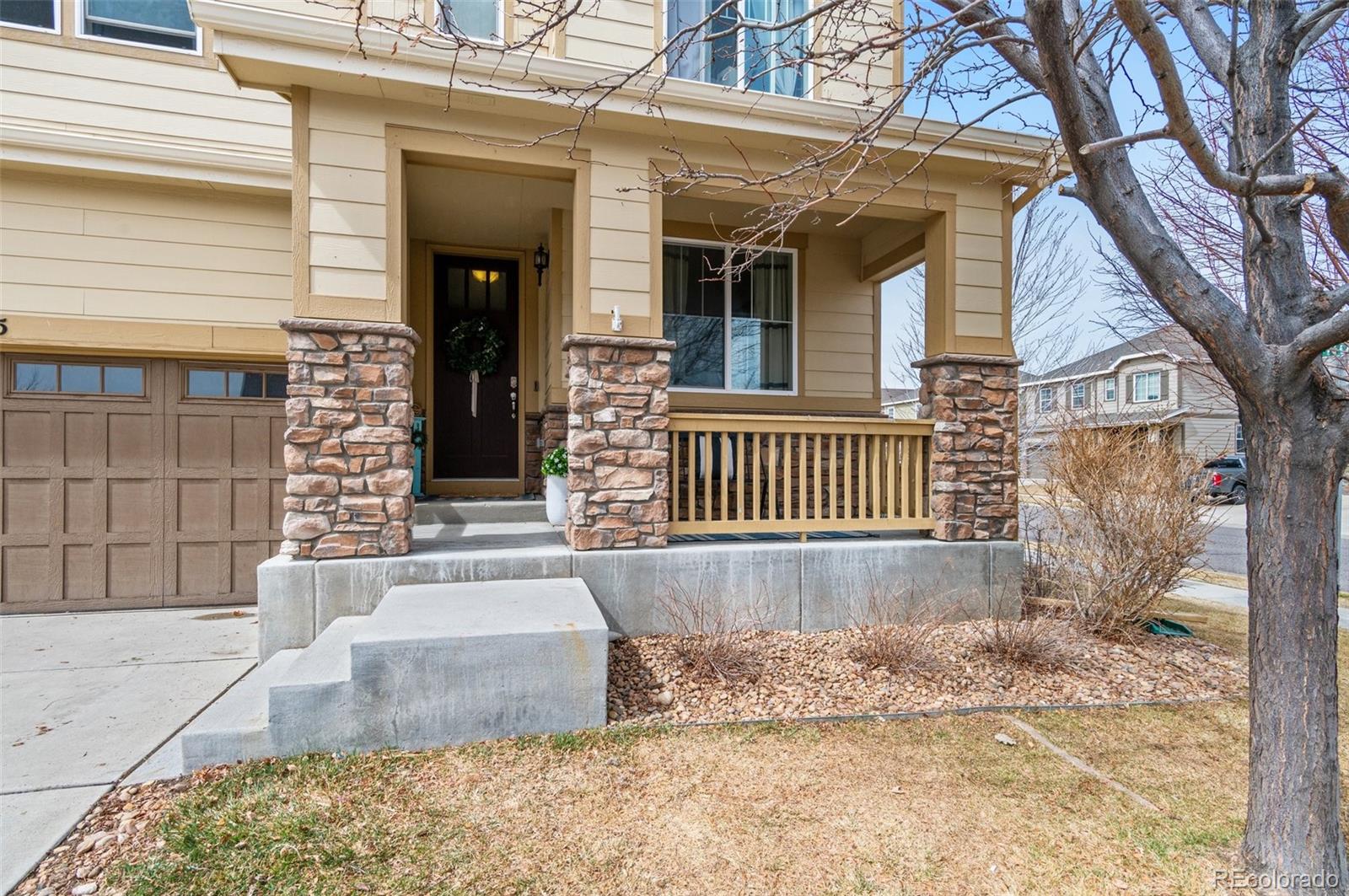 10995 Quintero Street Commerce City, CO 80022 - Photo 2 of 41 a view of a house with a yard