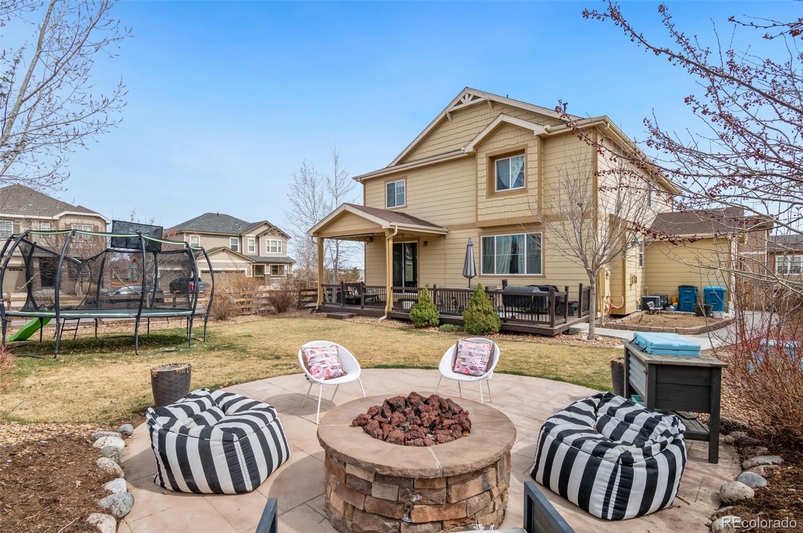 10995 Quintero Street Commerce City, CO 80022 - Photo 3 of 41 a view of a dinning table and a chairs in patio