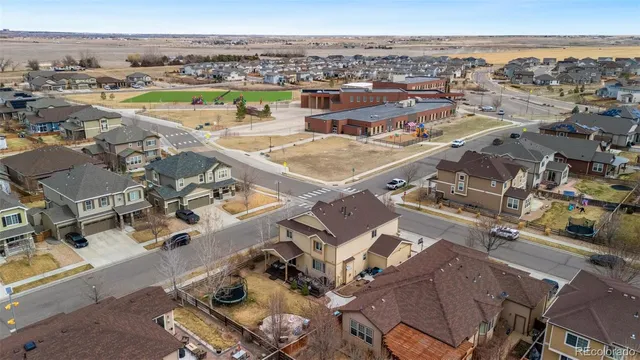 an aerial view of a city with ocean view