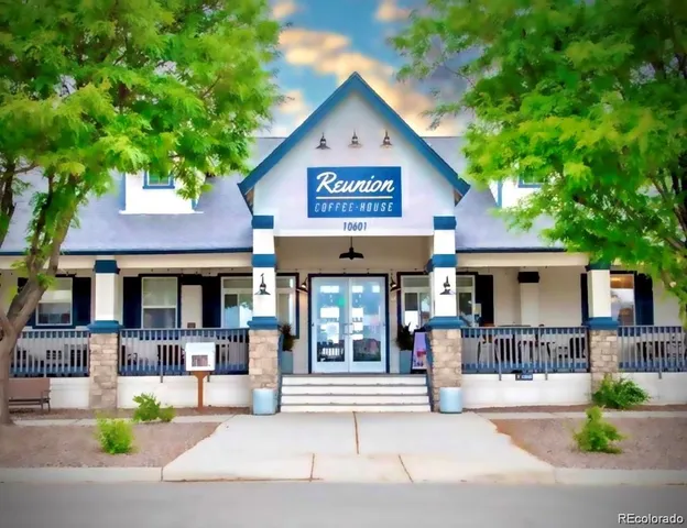 a view of a house with outdoor seating area