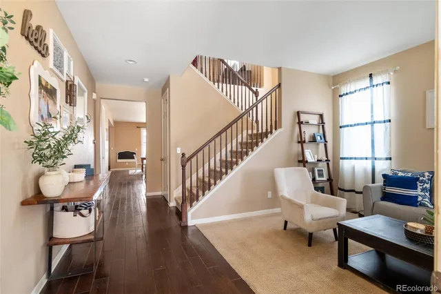 a living room with furniture and a table