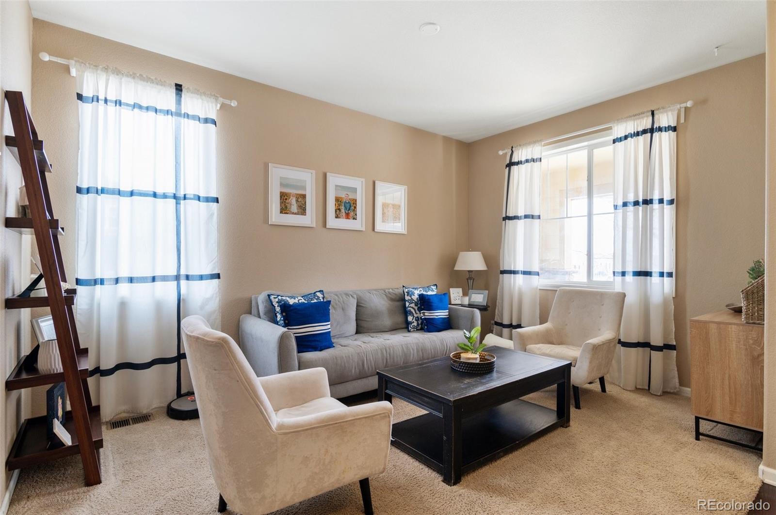 10995 Quintero Street Commerce City, CO 80022 - Photo 8 of 41 a living room with furniture and a window
