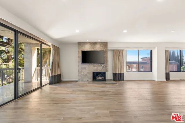 a kitchen with stainless steel appliances granite countertop a refrigerator and a stove