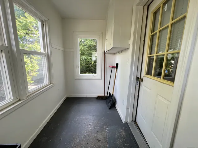 a view of a hallway with a window