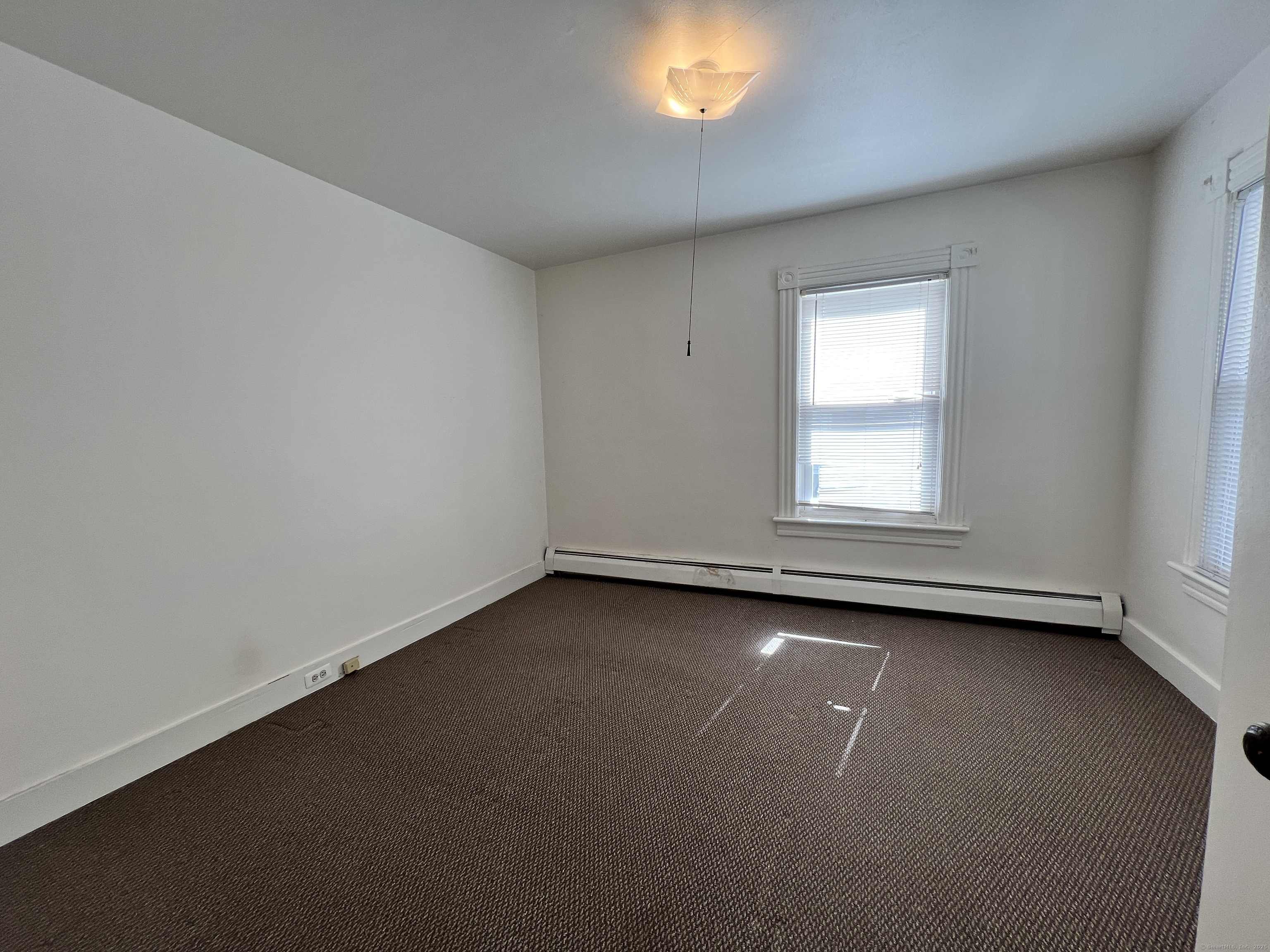 225 Beechwood Avenue Torrington, CT 06790 - Photo 5 of 11 an empty room with a window