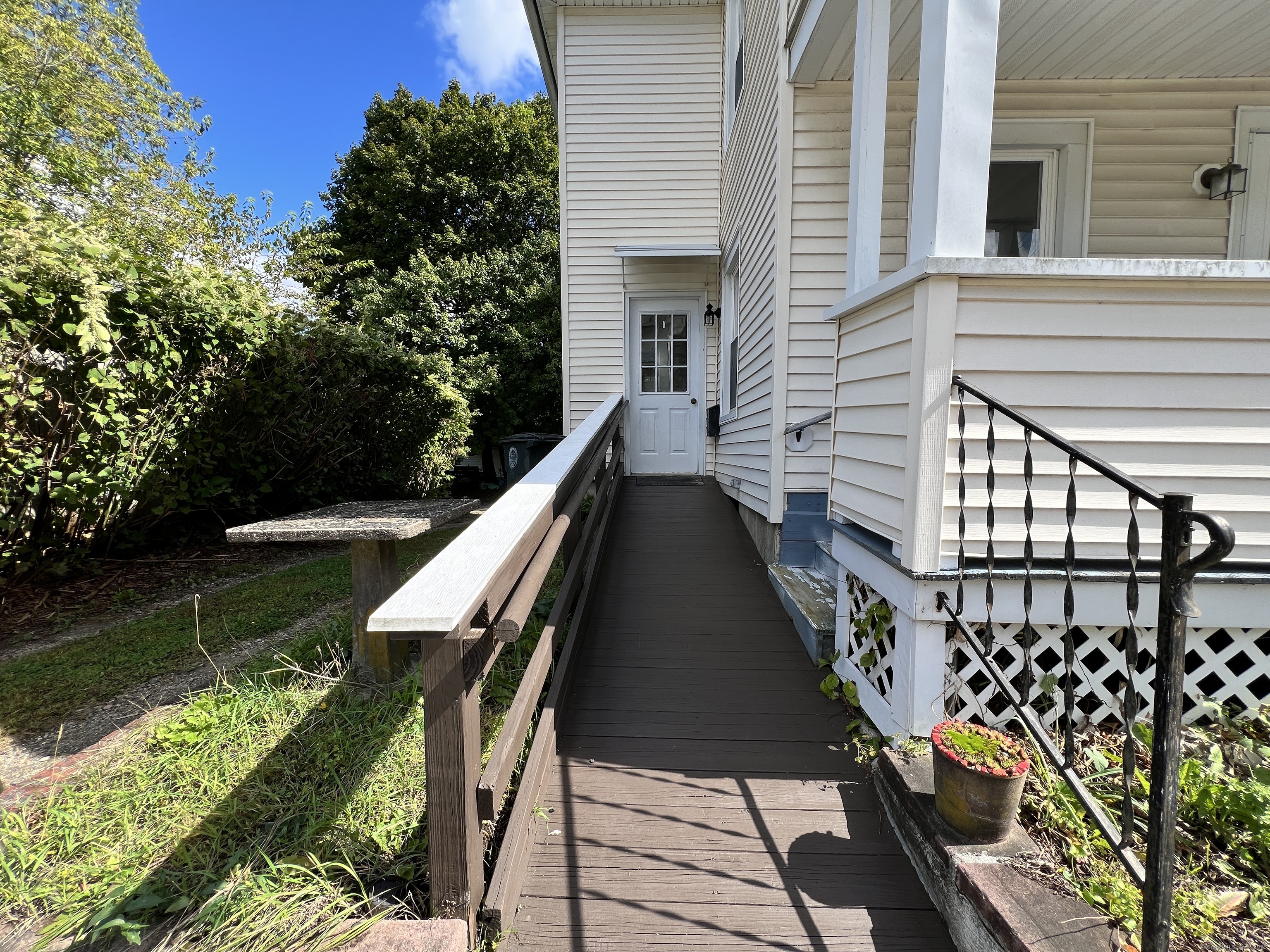 225 Beechwood Avenue Torrington, CT 06790 - Photo 9 of 11 a balcony with chairs and wooden fence