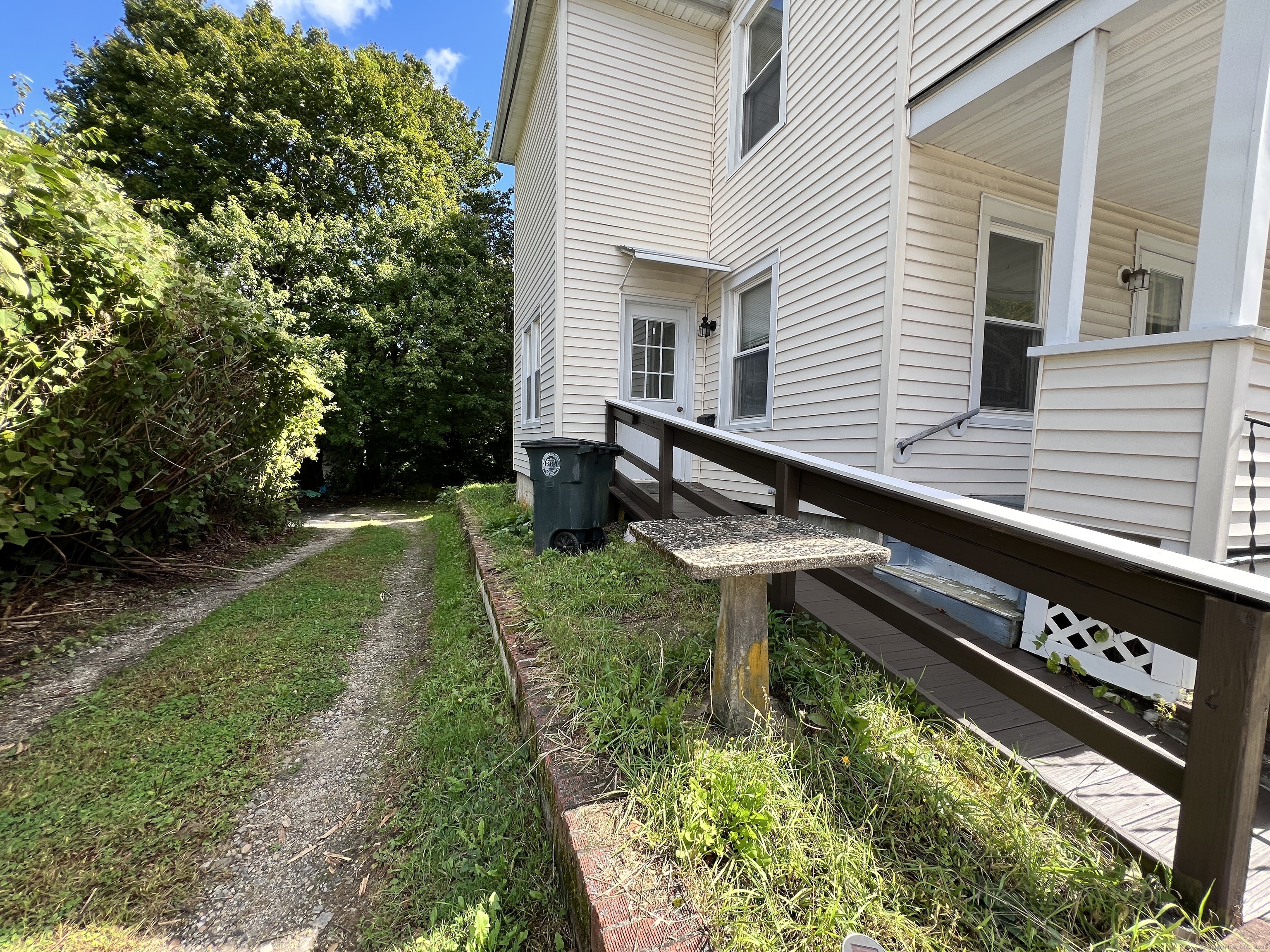 225 Beechwood Avenue Torrington, CT 06790 - Photo 10 of 11 a backyard of a house with outdoor seating