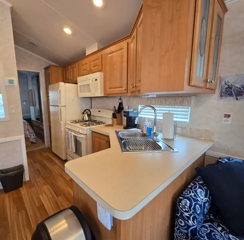a kitchen with a sink a stove and refrigerator