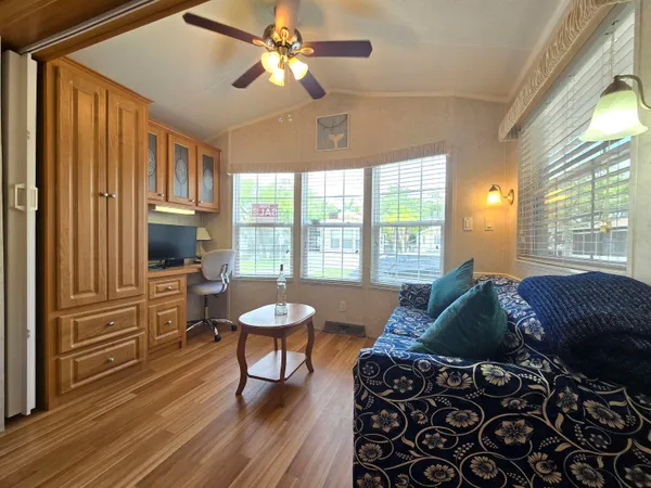 a living room with furniture and a window