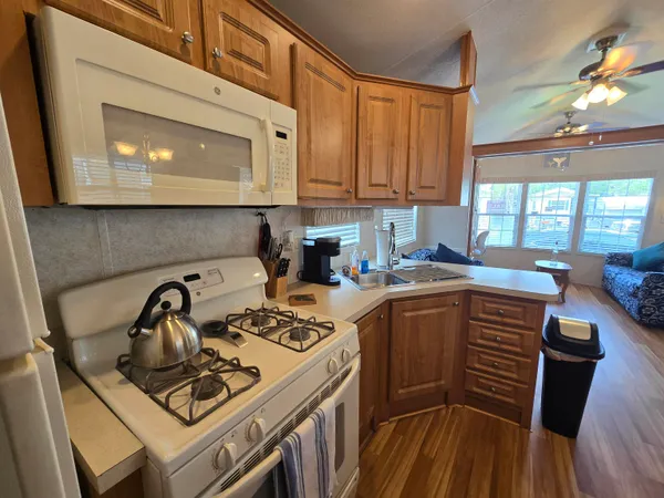 a kitchen with sink cabinets and appliances