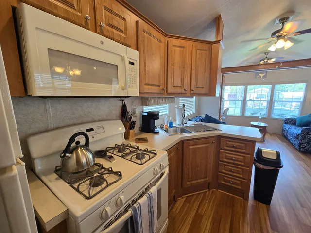 a kitchen with sink cabinets and appliances