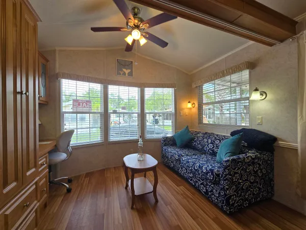 a living room with furniture and a window