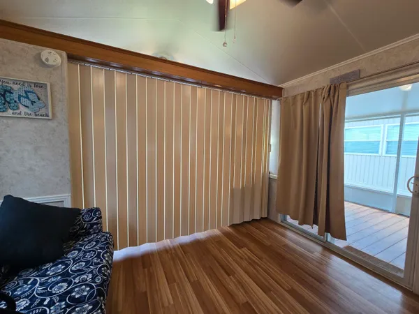 a view of a hardwood floor and staircase