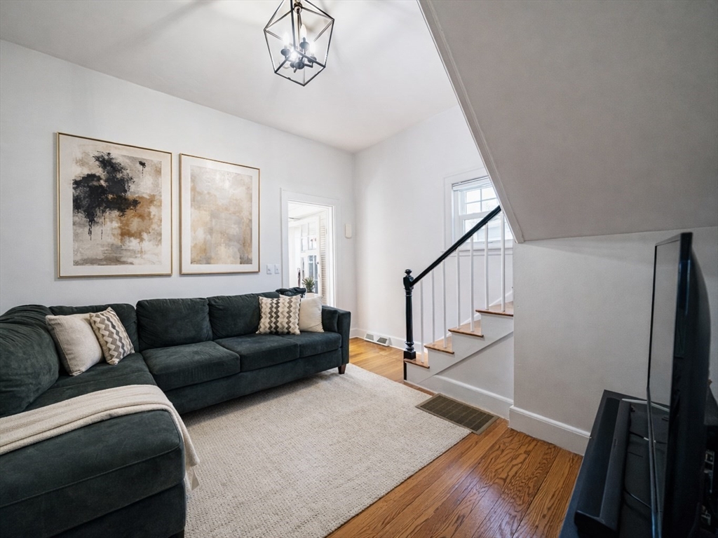 10 Guild Road Saugus, MA 01906 - Photo 8 of 32 a living room with furniture and a wooden floor