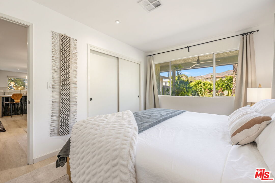 66869 San Ardo Road Desert Hot Springs, CA 92240 - Photo 27 of 39 a bedroom with a large bed and a window