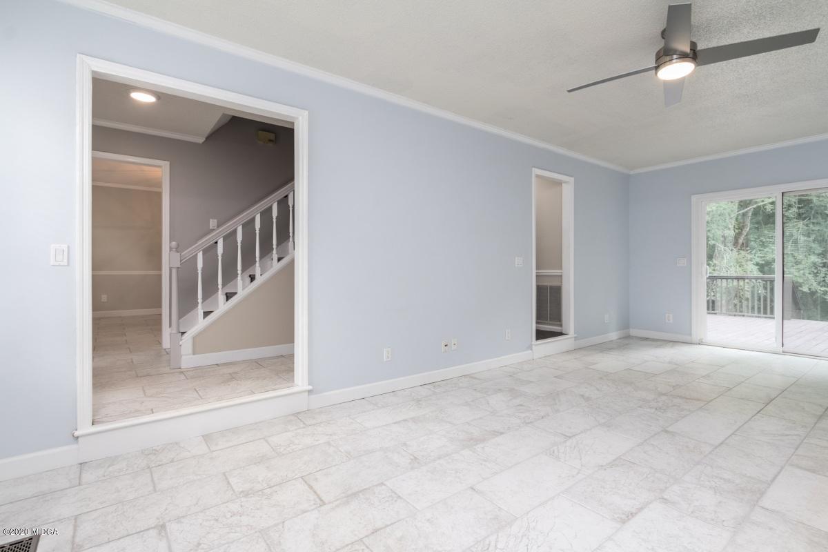 502 Stone Edge Road Macon, GA 31210 - Photo 5 of 22 a view of an empty room with a window