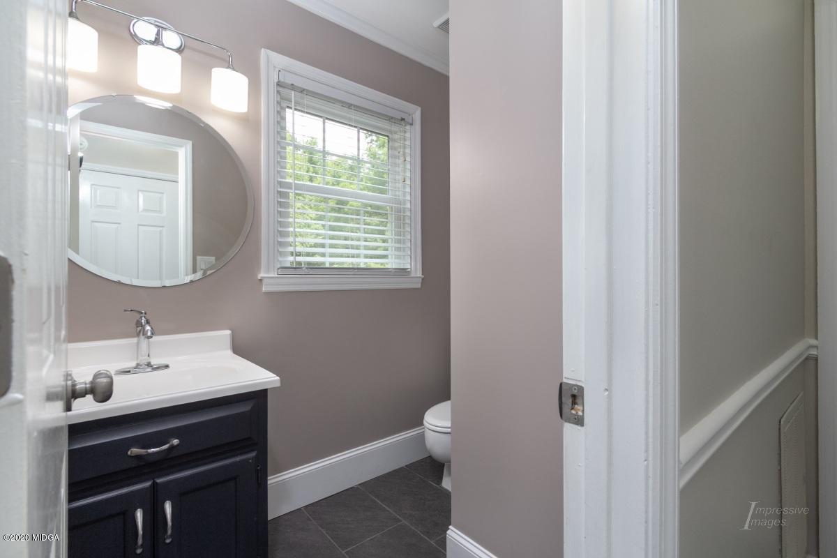 502 Stone Edge Road Macon, GA 31210 - Photo 8 of 22 a bathroom with a sink vanity and a mirror