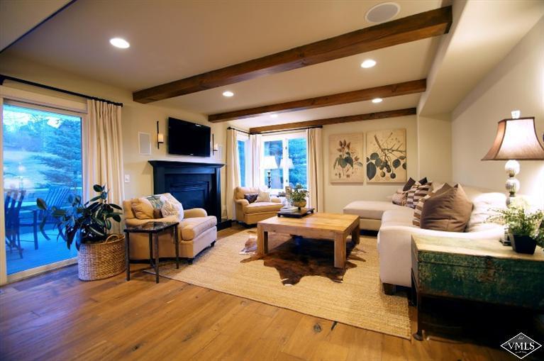 79 Cassidy Place Edwards, CO 81632 - Photo 2 of 8 a living room with furniture fireplace and a large window