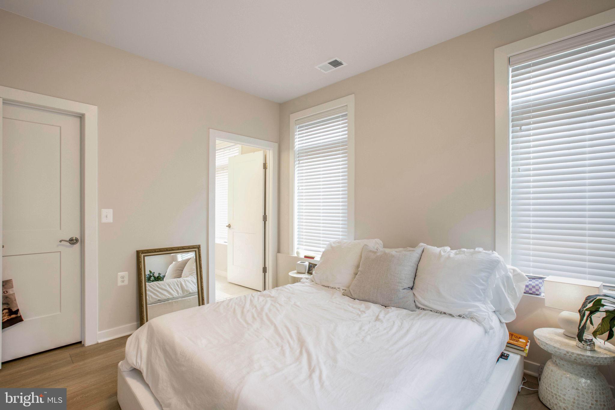 1669 Bandit Loop, Unit 107A Reston, VA 20190 - Photo 15 of 30 a bedroom with a bed and with furniture