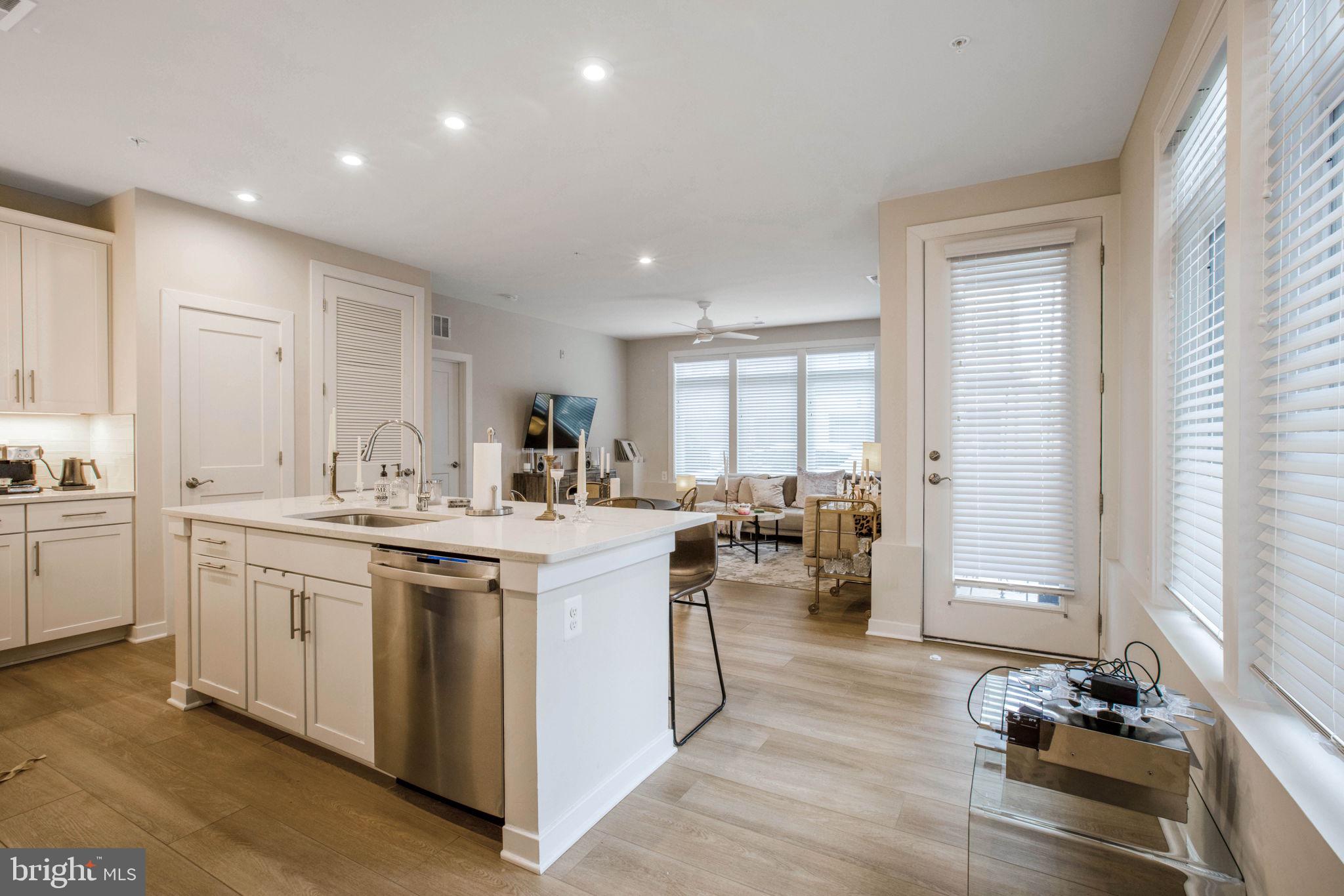 1669 Bandit Loop, Unit 107A Reston, VA 20190 - Photo 6 of 30 a kitchen with sink stove and refrigerator