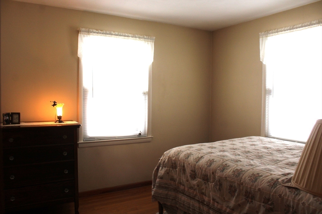 24 Metzger Place Springfield, MA 01104 - Photo 21 of 35 a bedroom with a bed and a window