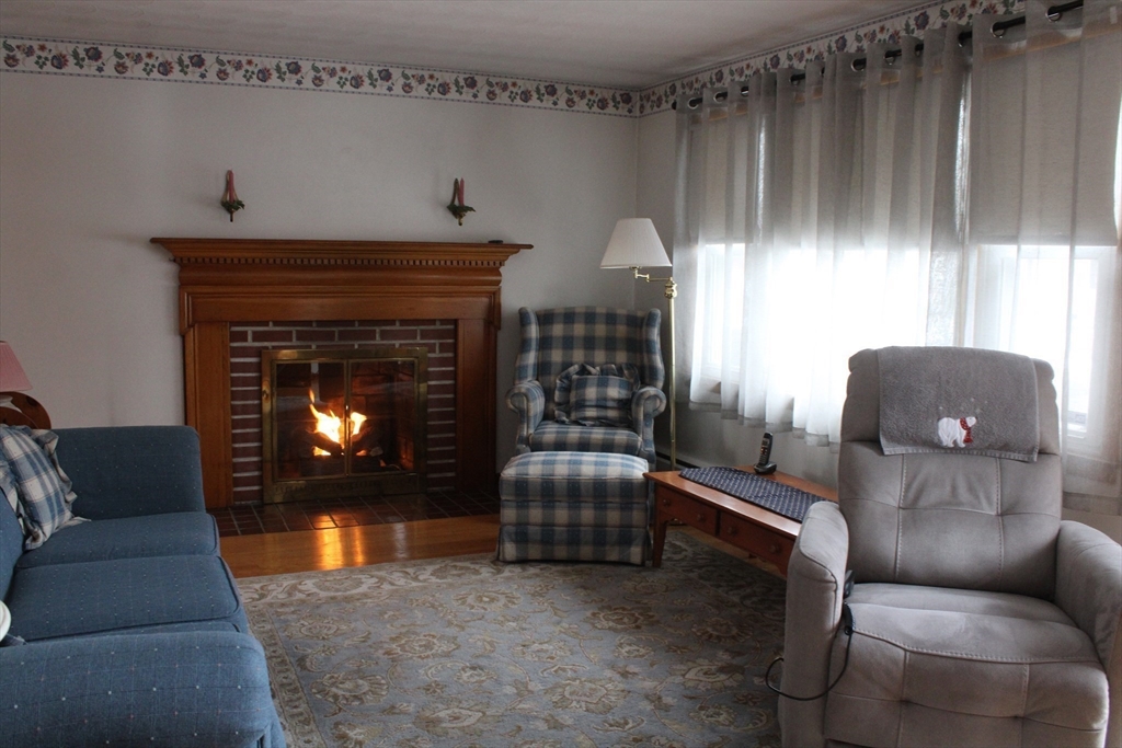 24 Metzger Place Springfield, MA 01104 - Photo 10 of 35 a living room with furniture and a fireplace