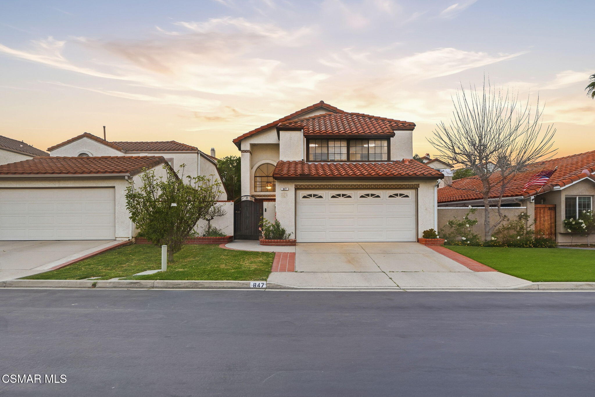 847 Links View Drive Simi Valley, CA 93065 - Photo 1 of 45 a front view of a house with a yard and garage