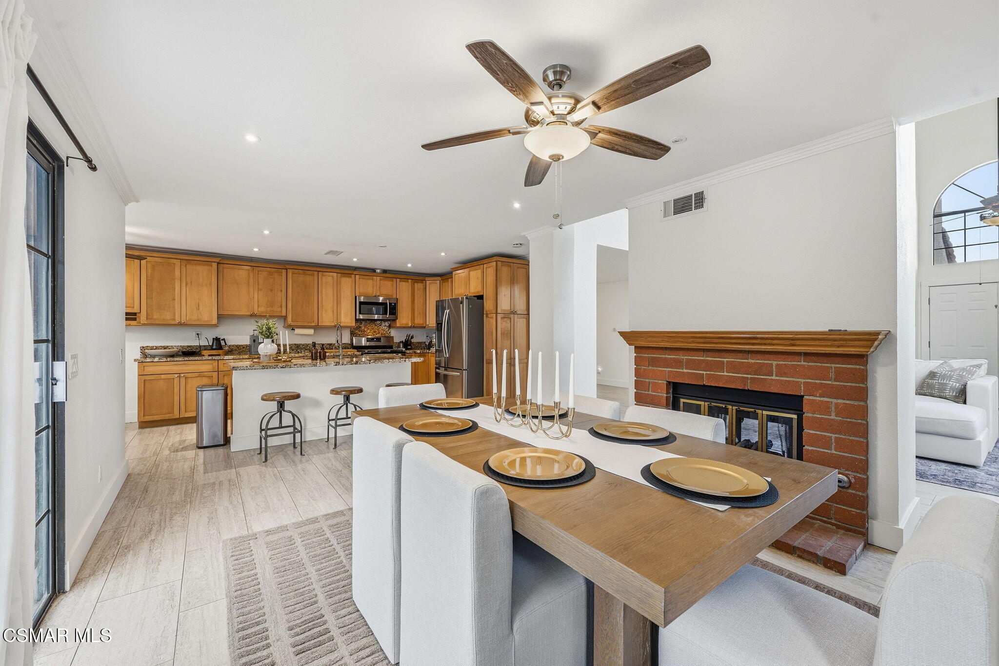 847 Links View Drive Simi Valley, CA 93065 - Photo 20 of 45 a open kitchen with stainless steel appliances kitchen island a stove a sink a refrigerator and a dining table