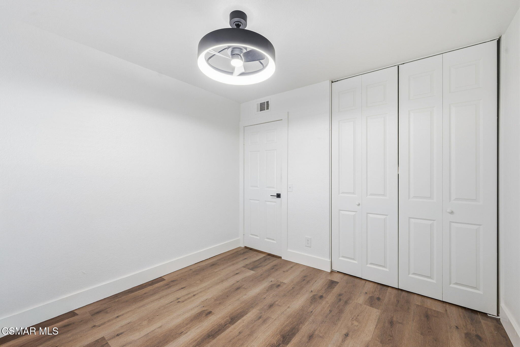 847 Links View Drive Simi Valley, CA 93065 - Photo 32 of 45 a view of empty room with wooden floor