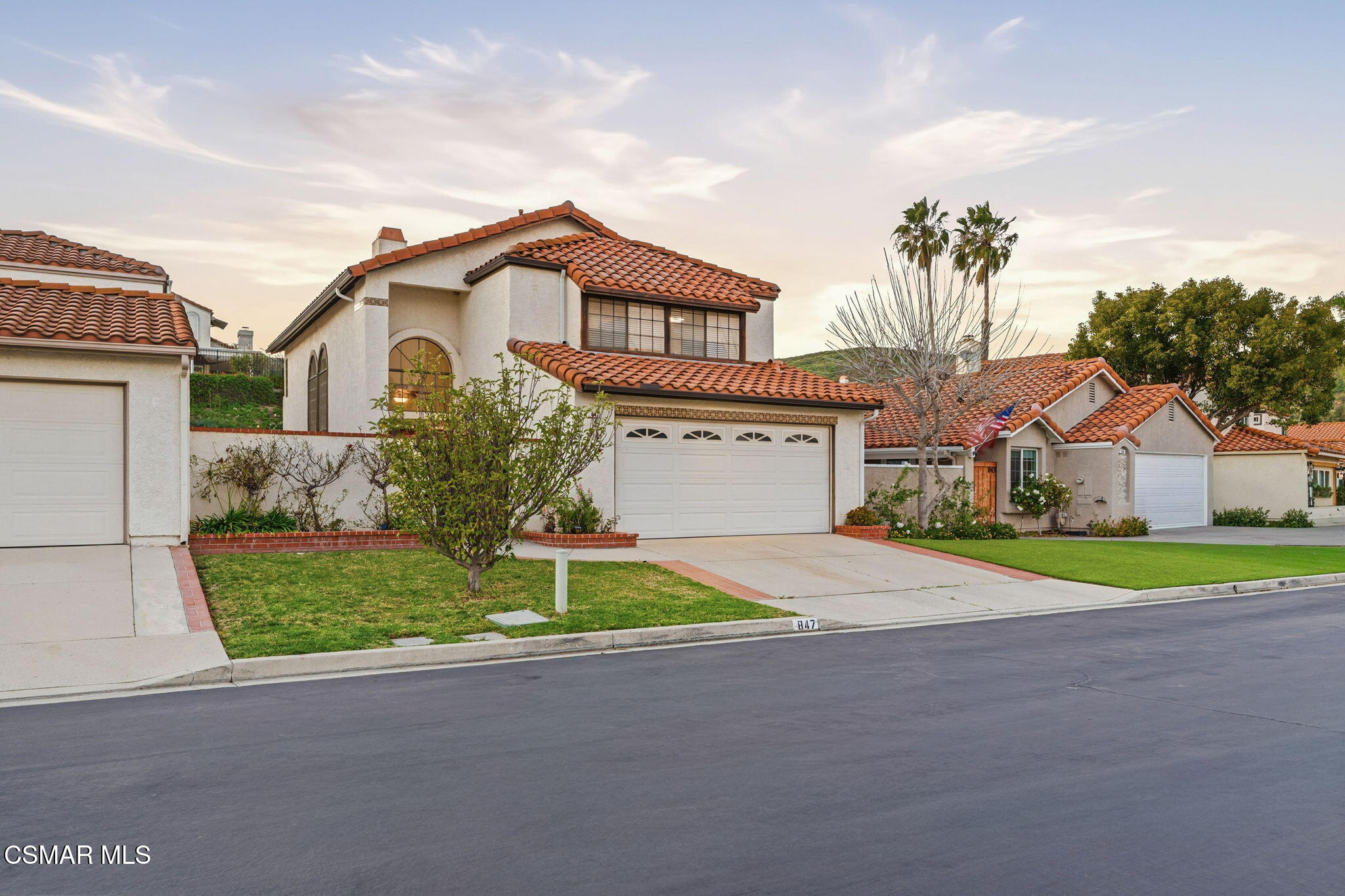 847 Links View Drive Simi Valley, CA 93065 - Photo 6 of 45 a front view of a house with a yard and garage