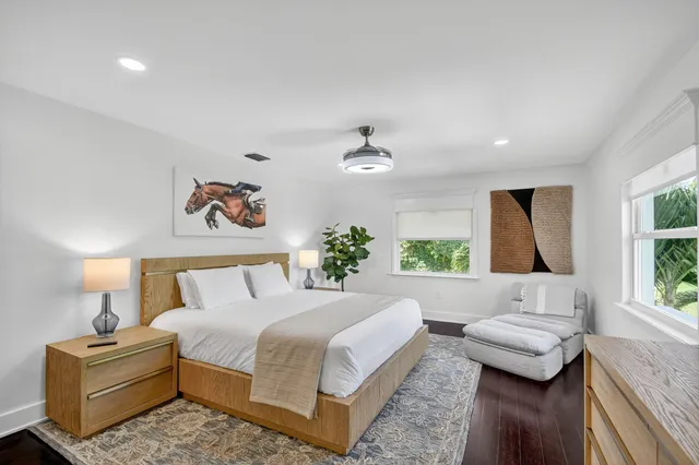 a bedroom with a large bed and a couch