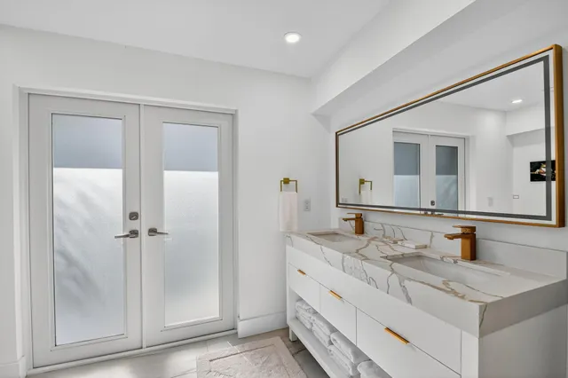 a bathroom with a sink and a mirror