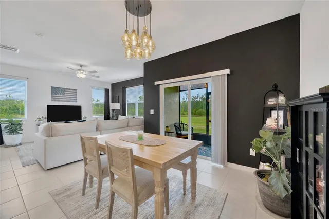 a kitchen with a sink a counter top space stainless steel appliances and cabinets
