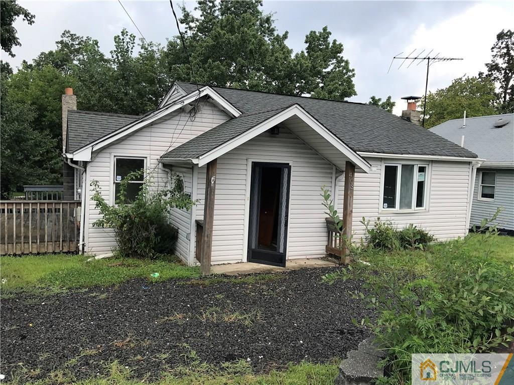 403 Matawan Road Old Bridge, NJ 08879 - Photo 1 of 11 a view of a house with yard and a garden