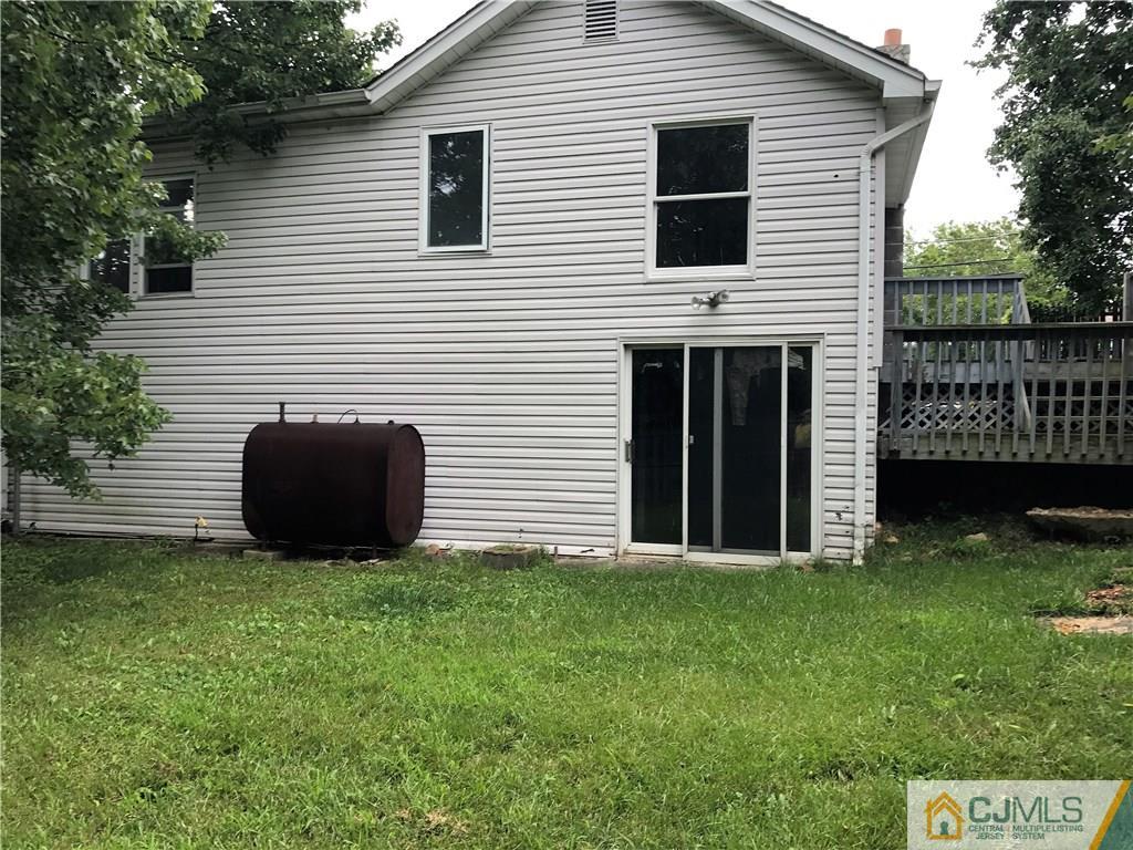 403 Matawan Road Old Bridge, NJ 08879 - Photo 2 of 11 a view of a house with a yard and a garden