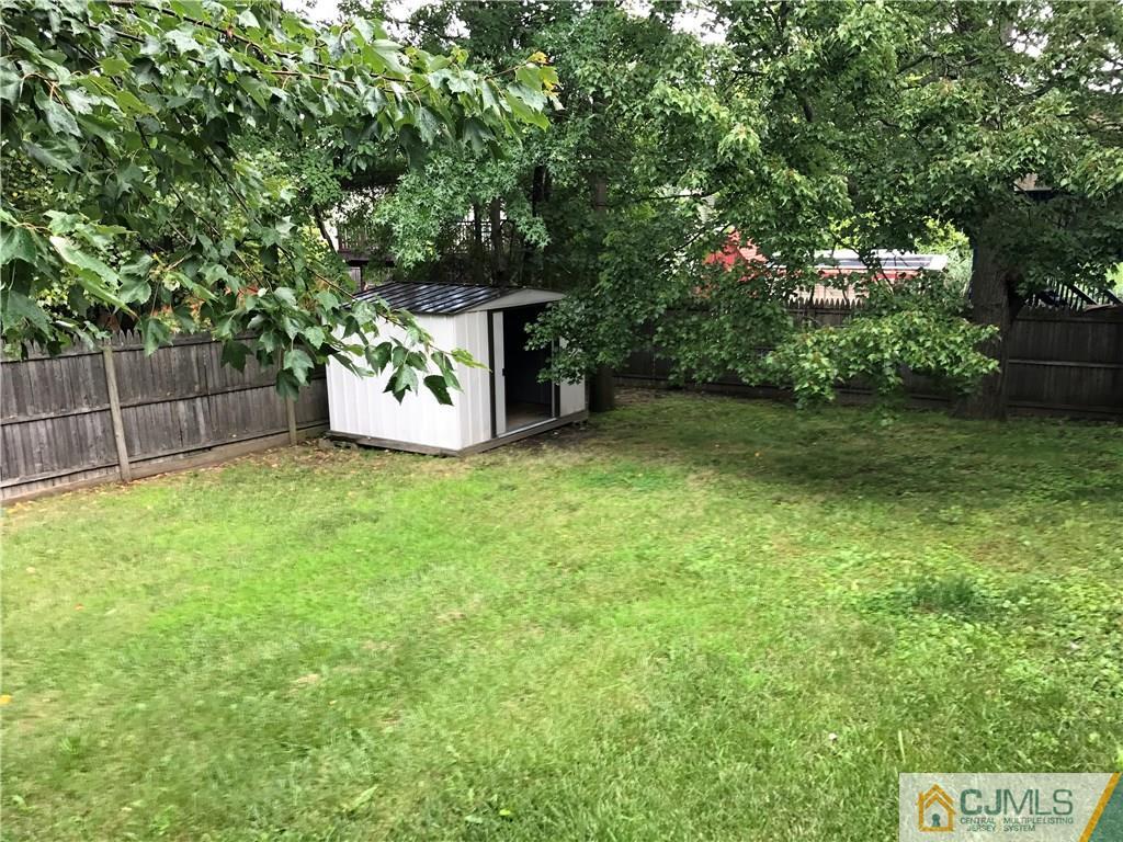 403 Matawan Road Old Bridge, NJ 08879 - Photo 3 of 11 a view of a field with a tree