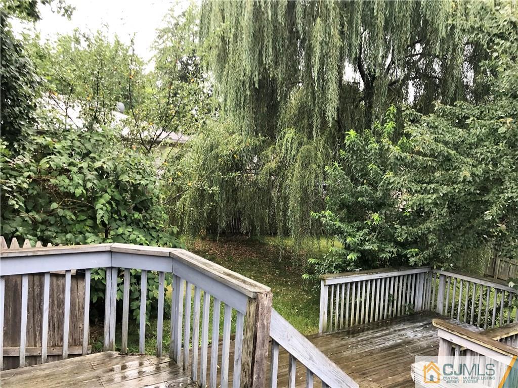 403 Matawan Road Old Bridge, NJ 08879 - Photo 6 of 11 a view of balcony with wooden fence