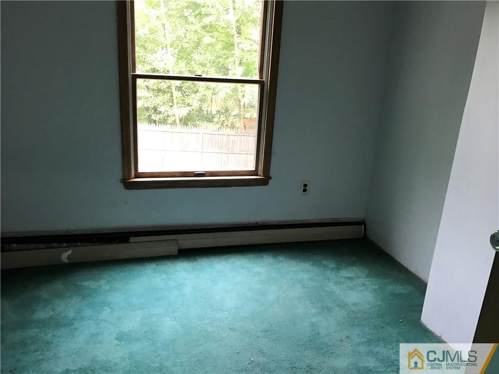 403 Matawan Road Old Bridge, NJ 08879 - Photo 9 of 11 a view of a room with window